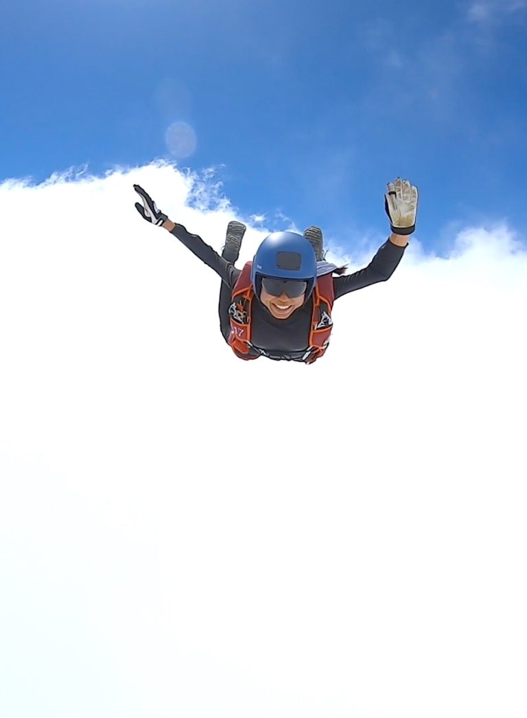 Indian skydiver shweta flying through clouds